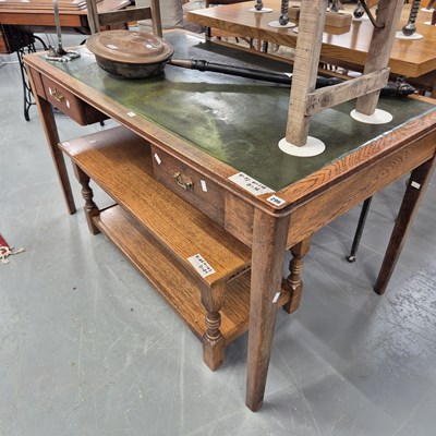 Lot 296 - An oak writing desk H 77 W 138 D 76cm