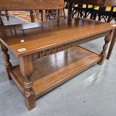 Lot 299 - An oak coffee table. H 46 W 102 D 49cm.