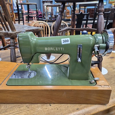 Lot 300 - A Borletti retro sewing machine and a pottery...