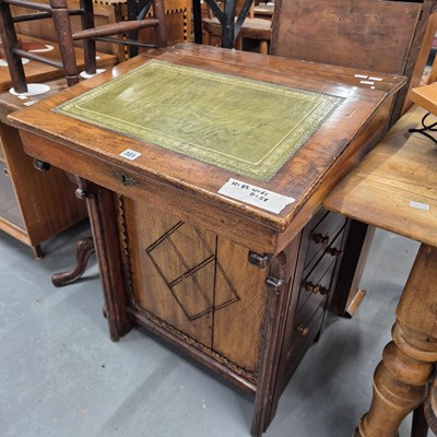 Lot 301 - A Davenport desk. H 85 W 61 D 58cm.