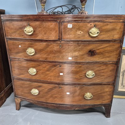 Lot 311 - A Georgian mahogany bow front chest of five...