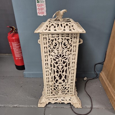 Lot 321 - An antique cast iron conservatory heater. H 75cm