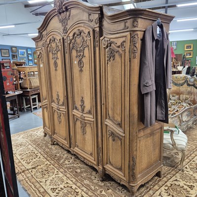 Lot 323 - An impressive very large French oak four door...