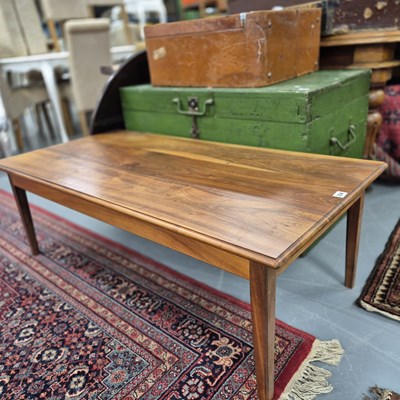 Lot 334 - A 1970s hardwood coffee table. H 42 W 122 D 60cm.