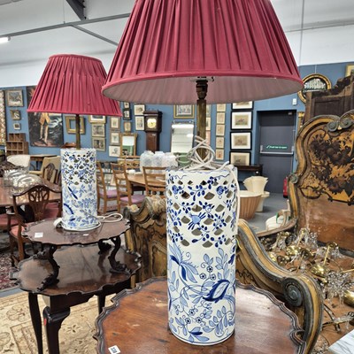 Lot 339 - A pair of blue and white pottery lamps.