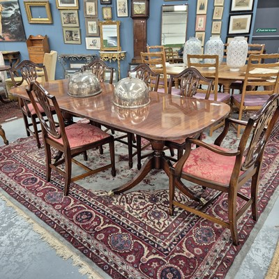 Lot 353 - A Regency style mahogany dining table and six...