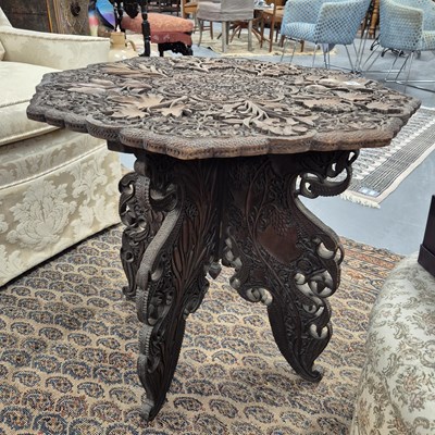 Lot 364 - A carved eastern occasional table. H 60 D 60cm.