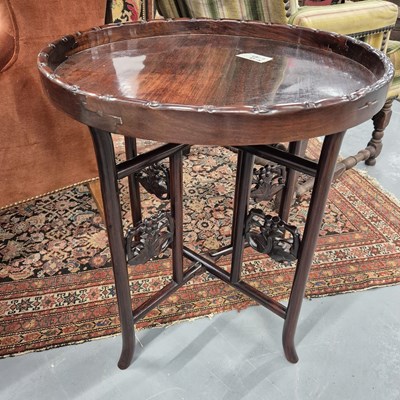 Lot 369 - An oriental hardwood occasional table on...