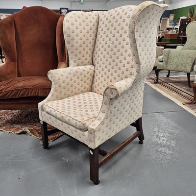 Lot 370 - A large 19th century wing back armchair.