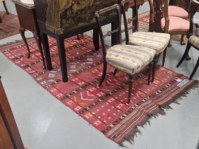 Lot 1157 - A Tribal flat weave rug, 258cm x 129 cm
