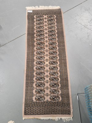 Lot 1165 - An oriental runner of Bokhara design, 185cm x...
