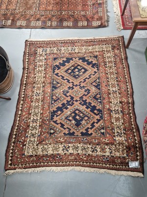 Lot 1169 - An antique Persian tribal fragment, 114cm x 143cm