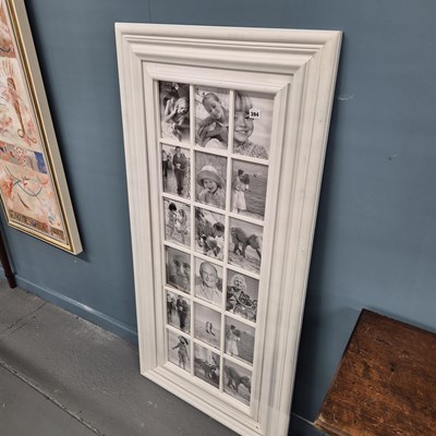 Lot 394 - A divided photo wall frame. 133x64cm