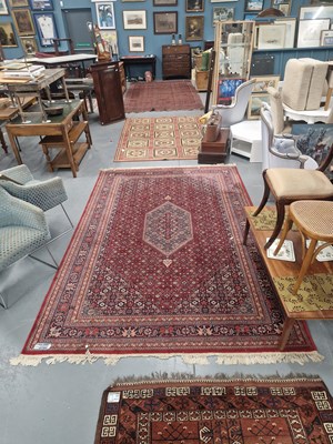 Lot 1174 - A machine made rug of Persian design, 200cm x...