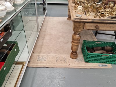 Lot 1153 - A machine made rug of Tibetan design. 170 x 240cm