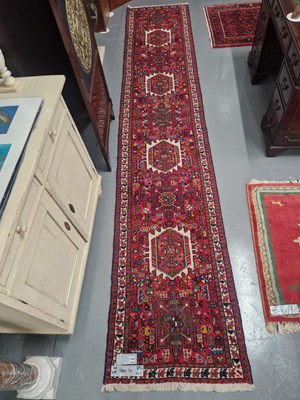 Lot 1184 - A Persian Karadja runner 398cm x 74cm