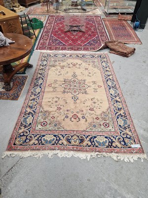 Lot 1194 - An oriental carpet of Persian design. 202 x 305cm