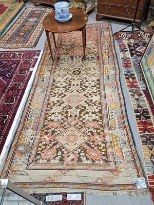 Lot 1195 - An antique Caucasian tribal rug, 358 x 157cm