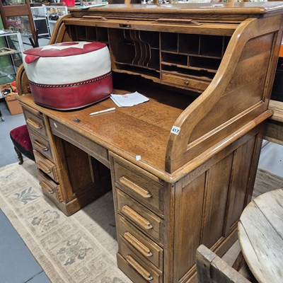 Lot 417 - A large oak roll top desk and a retro pouffe....