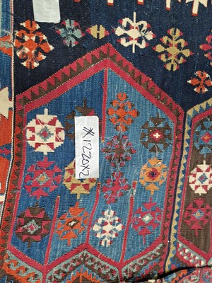 Lot 1220 - An antique Turkish tribal kelim rug, (two...