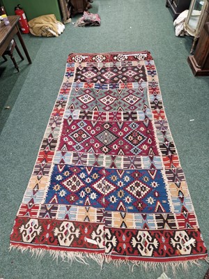 Lot 1221 - An antique Turkish tribal kelim rug (two...