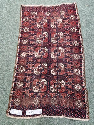 Lot 1222 - An antique Afghan Bokhara rug, 166 x 91cm