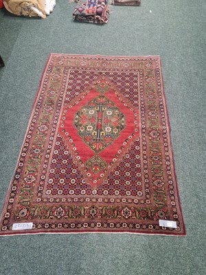 Lot 1224 - An unusual finely woven antique Persian rug,...