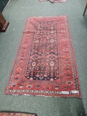 Lot 1227 - An antique Persian tribal rug, 299 x 166cm