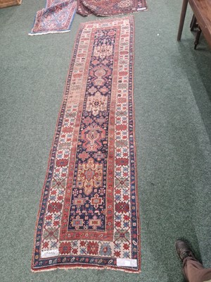 Lot 1232 - An unusual antique Caucasian tribal runner 370...