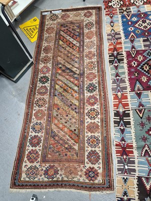 Lot 1199 - An antique Caucasian runner of distinctive...