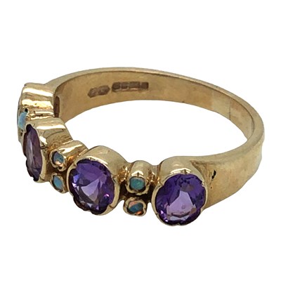 Lot 1088 - A 9ct hallmarked gold amethyst and opal ring....