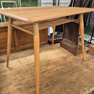 Lot 421 - A small pale elm Ercol dining table. H 73 W...