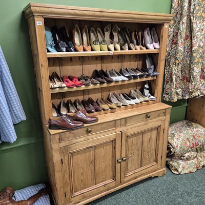 Lot 437 - An antique pine dresser with integral plate...