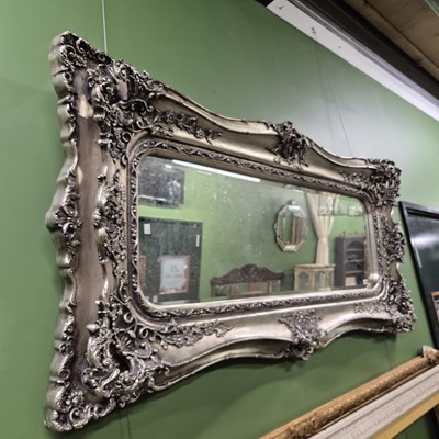 Lot 456 - An impressive wall mirror with silvered frame....