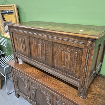 Lot 115 - An oak panel front coffer. H 52 W 105 D 45cm.