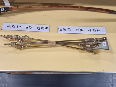 Lot 887 - A set of four brass fire irons