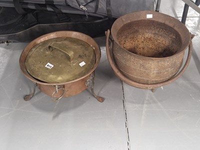 Lot 914 - An iron caludron together with a brass lidded...