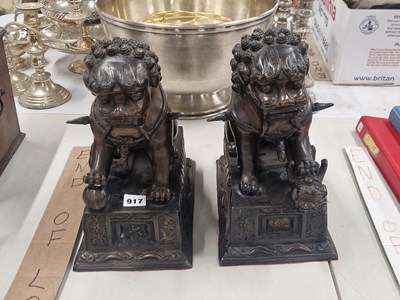 Lot 917 - A pair of Chinese bronze Buddhist lions seated...