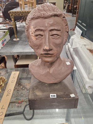 Lot 948 - A sculpted clay head of a man