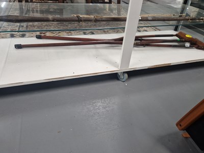 Lot 951 - A pair of leather topped crutches