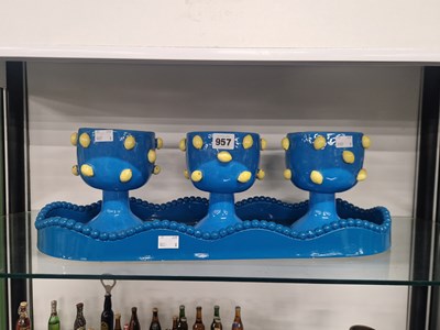 Lot 957 - Three  blue ground goblets applied with yellow...