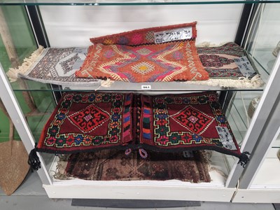 Lot 961 - A collection of middle eastern small rugs and...