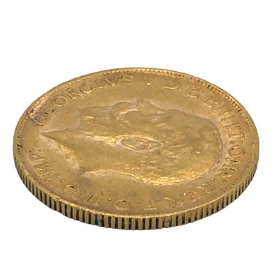 Lot 1112 - A 22ct gold full sovereign coin dated 1928...