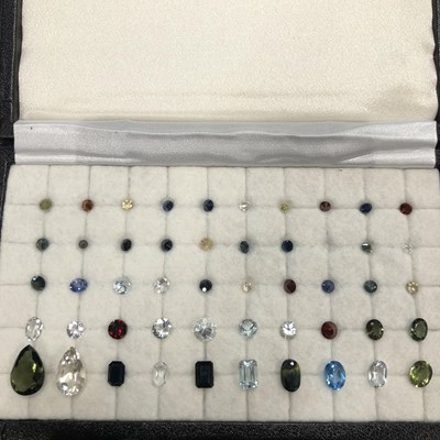 Lot 1114 - A collection of various cut gemstones,...