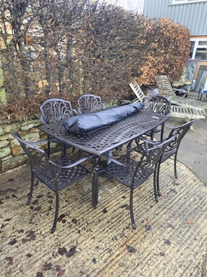 Lot 1262 - An alloy garden table, six chairs and a parasol