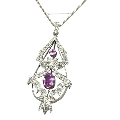 Lot 1120 - A 9ct hallmarked white gold, diamond and pink...