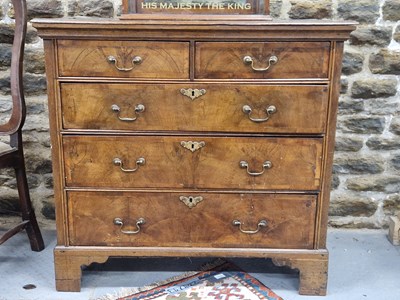 Lot 1309 - An early 19th century oak chest, the two short...