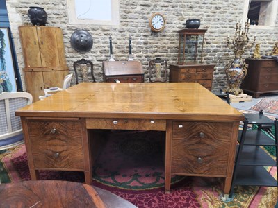 Lot 1307 - A 20th century walnut partner's desk with two...