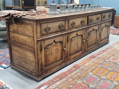 Lot 1320 - A 19th century style oak dresser with four...