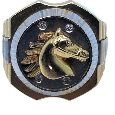 Lot 1133 - A diamond set signet ring. The watch style...